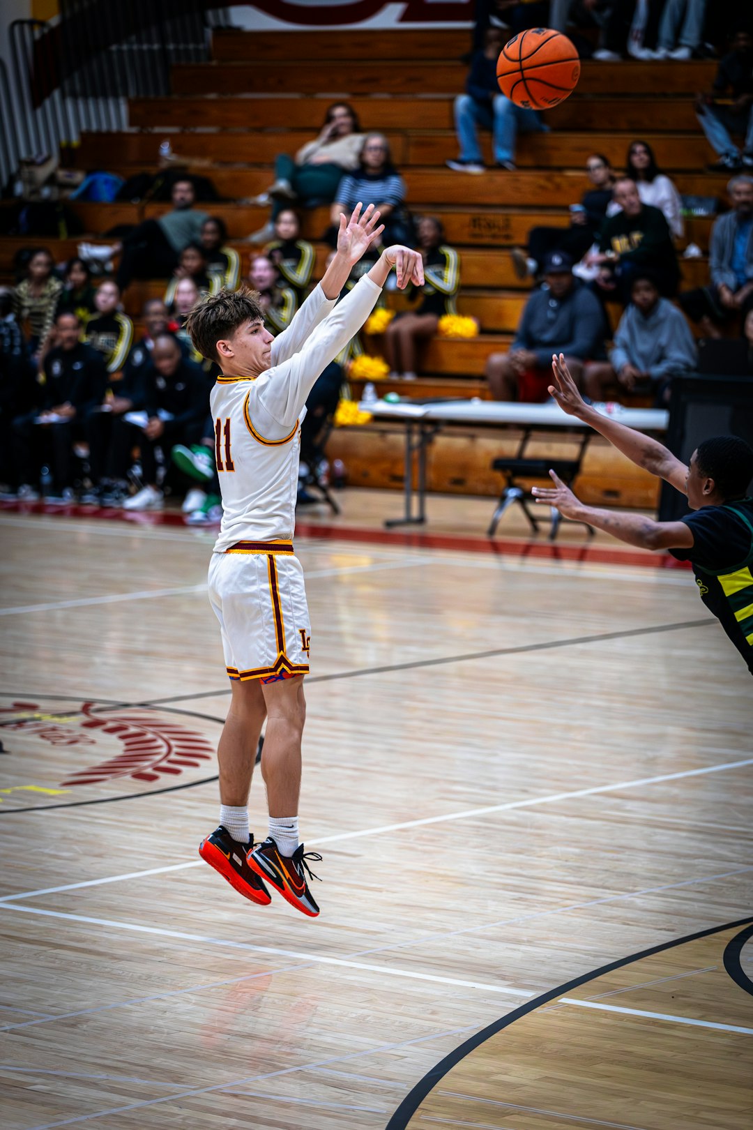 Basketball player taking a shot during a game